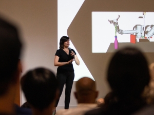 image of woman giving a speech on stage